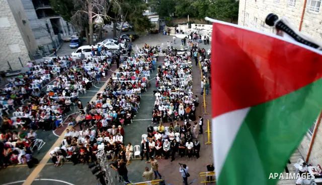 Palestinians watch a ceremony and performance commemorating the 1967 setback in Jerusalem on June 04,2012. Students movement homeland of the Hebrew University salutes the anniversary of the setback in 1967. The setback i...