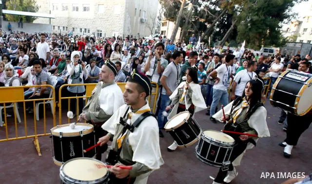 Palestinians watch a ceremony and performance commemorating the 1967 setback in Jerusalem on June 04,2012. Students movement homeland of the Hebrew University salutes the anniversary of the setback in 1967. The setback i...