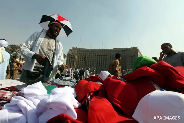 An Egyptian sells caps during a demonstration at Tahrir square in Cairo June 5, 2012. Activists urged Egyptians to turn out for a big protest on Tuesday to reclaim a revolt they say has been hijacked after Hosni Mubarak...