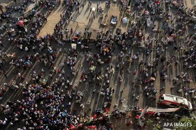 Egyptian protesters wave national flags during a demonstration in Cairo's landmark Tahrir Square on June 5, 2012 to protest against verdicts handed down in ex-president Hosni Mubarak's murder trial. Mubarak and his inter...