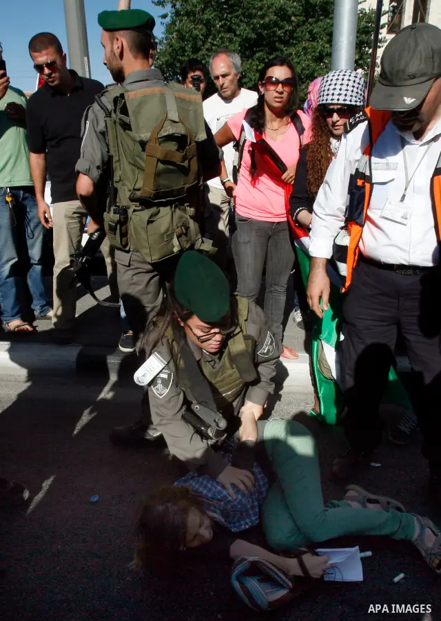 Israeli police arrest a Palestinian protester during a demonstration marking the 'Naksa Day' at the Damascus Gate on 05 June 2012. Naksa Day is the annual day of commemoration for the Palestinian people of the displaceme...
