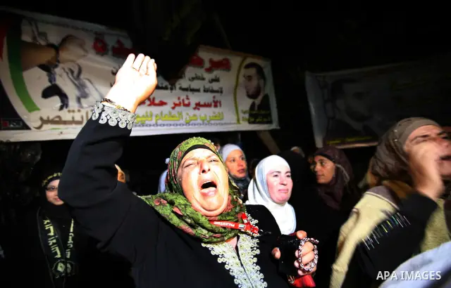 Palestinians celebrate after the Israeli authorities released prisoner Thaer Halahleh in the West Bank Village of Kharas near Hebron on June 05, 2012. Thaer Halahla, 33, from Hebron was in administrative detention for th...