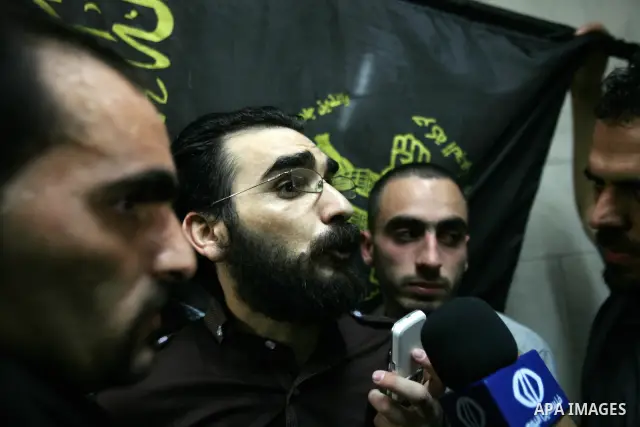 Thaer Halahleh talks to press after the Israeli authorities released him in the West Bank Village of Kharas near Hebron on June 05, 2012. Thaer Halahla, 33, from Hebron was in administrative detention for the past 24 mon...