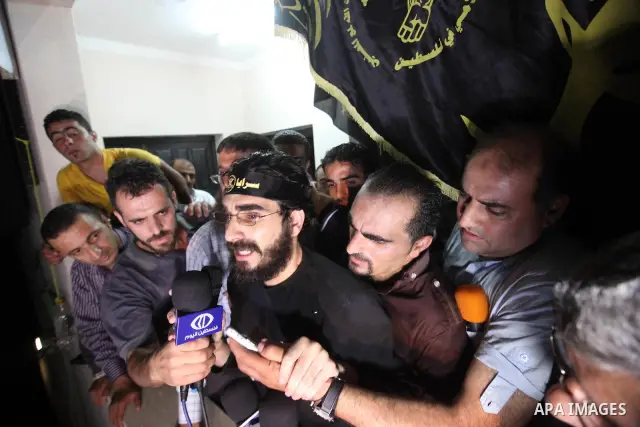 Thaer Halahleh talks to press after the Israeli authorities released him in the West Bank Village of Kharas near Hebron on June 05, 2012. Thaer Halahla, 33, from Hebron was in administrative detention for the past 24 mon...