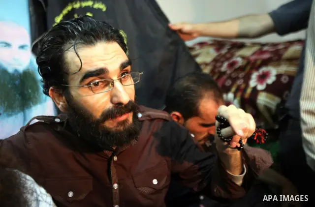 Thaer Halahleh talks to press after the Israeli authorities released him in the West Bank Village of Kharas near Hebron on June 05, 2012. Thaer Halahla, 33, from Hebron was in administrative detention for the past 24 mon...