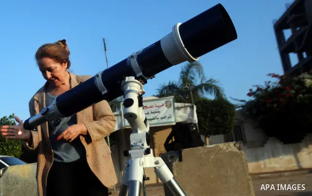 Palestinians look through a telescopes during the transit of planet Venus across the sun face during a rare celestial event in the Gaza Strip, 06 June 2012. Astronomy enthusiasts all over the world looked to the skies to...