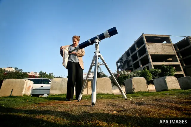 Palestinians look through a telescopes during the transit of planet Venus across the sun face during a rare celestial event in the Gaza Strip, 06 June 2012. Astronomy enthusiasts all over the world looked to the skies to...