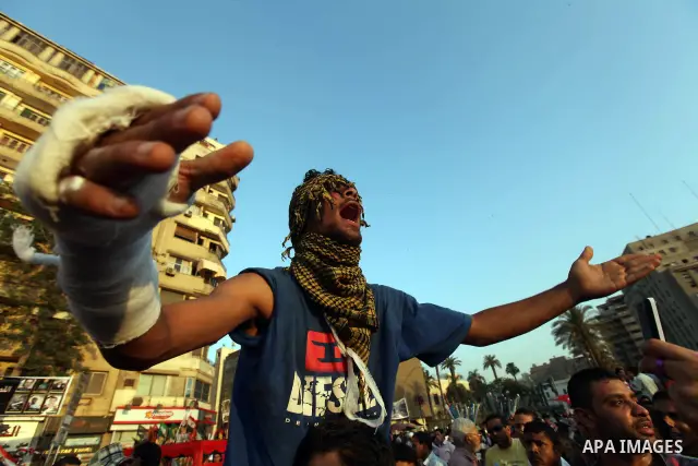 Egyptian protesters chant slogans during a demonstration in Cairo's landmark Tahrir Square on June 6, 2012 to protest against verdicts handed down in ex-president Hosni Mubarak's murder trial. Mubarak and his interior mi...