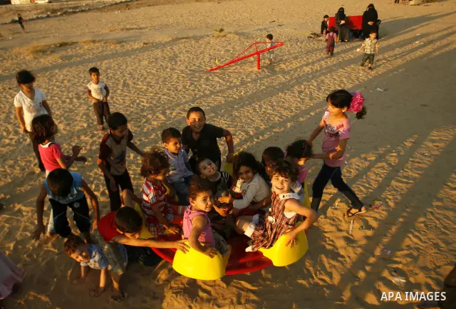 Palestinian children play at a park during the summer holiday in the Rafah refugee camp southern Gaza Strip on June 07, 2012. Photo by Eyad Al Baba