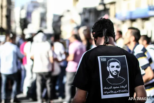 Palestinian youth play football in the streets of Ramallah during a rally solidarity with Palestinian prisoner Mahmoud Al-Sarsak who is still refusing food after a deal was made to end a mass prisoner hunger strike, on 0...