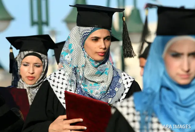 Palestinian students celebrate during the 32nd Graduation Ceremony at Al - Najah University in The West Bank City of Nablus on 07 June 2012. Al - Najah University is a Palestinian non-governmental public university gover...