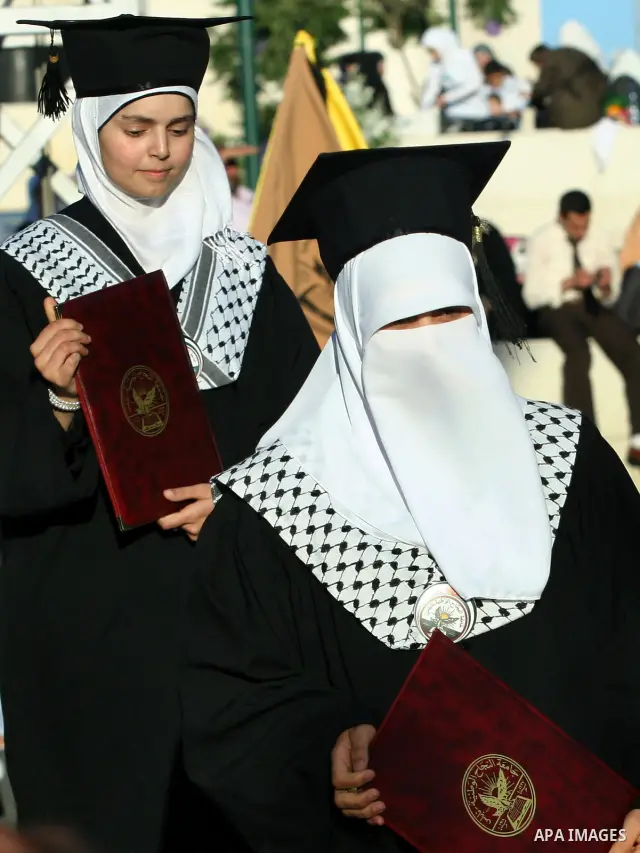 Palestinian students celebrate during the 32nd Graduation Ceremony at Al - Najah University in The West Bank City of Nablus on 07 June 2012. Al - Najah University is a Palestinian non-governmental public university gover...
