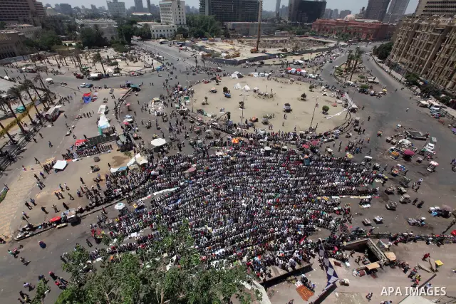 Egyptian Protesters gather for Friday prayers before a demonstration against presidential candidate Ahmed Shafiq in central Cairo's Tahrir Square, as hundreds of people gathered after the Friday noon prayer on June 8, 20...