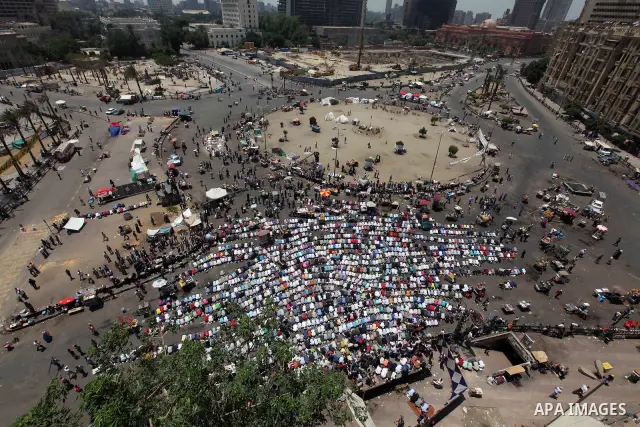 Egyptian Protesters gather for Friday prayers before a demonstration against presidential candidate Ahmed Shafiq in central Cairo's Tahrir Square, as hundreds of people gathered after the Friday noon prayer on June 8, 20...