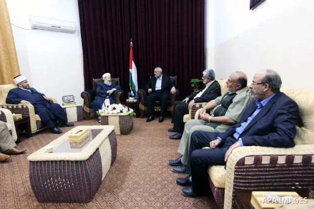 Palestinian Prime Minister in Gaza Strip, Ismail Haniya, meets with the world, Sheikh Abdel-Moneim Abu Alzant, in his office in Gaza City, on Jun 10,2012. Photo by Ahmed Shaat