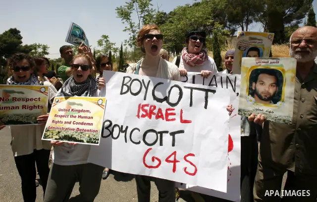 Palestinians and Foreigners hold posters depicting prisoners Mahmoud Al-Sarsak, and Akram al-Rekhawi during a rally in solidarity with them in the red cross offices in jerusalem city, on June 11, 2012. Photo by Mahfouz A...