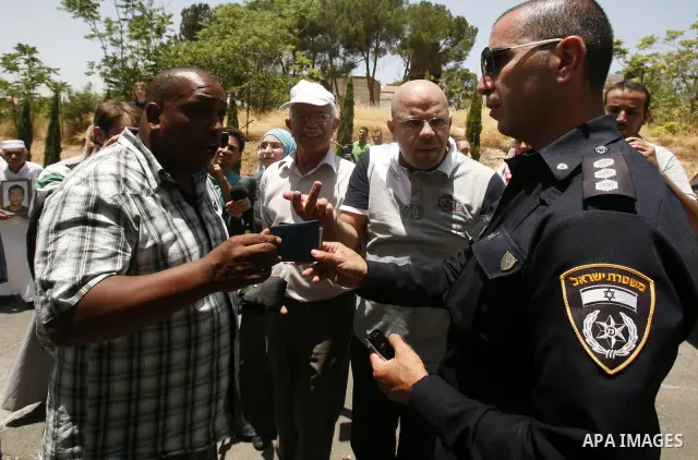 Palestinians and Foreigners hold posters depicting prisoners Mahmoud Al-Sarsak, and Akram al-Rekhawi during a rally in solidarity with them in the red cross offices in jerusalem city, on June 11, 2012. Photo by Mahfouz A...