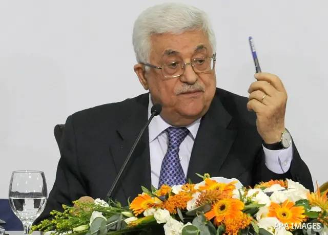 Palestinian President, Mahmoud Abbas (Abu Mazen), signs the franchise agreement with the Japanese government in the West Bank city of Ramallah on June 12, 2012. Photo by Thaer Ganaim