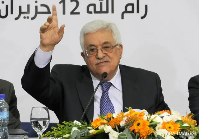 Palestinian President, Mahmoud Abbas (Abu Mazen), signs the franchise agreement with the Japanese government in the West Bank city of Ramallah on June 12, 2012. Photo by Thaer Ganaim