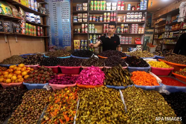 A Palestinian vendor sells pickles at the popular AlZawya market in Gaza City on June. 12, 2012 . Photo by Ashraf Amra