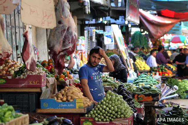 A Palestinian vendor stands in his shop at the popular AlZawya market in Gaza City on June. 12, 2012 . Photo by Ashraf Amra