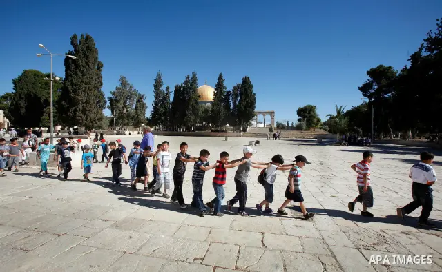 Palestinian children participate in summer camps at Al-Aqsa mosque in the old city of Jerusalem on 12 June 2012. Photo by Mahfouz Abu Turk