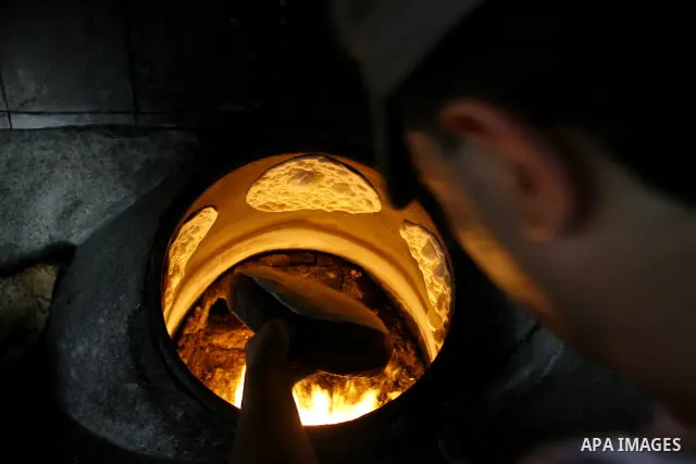 A Palestinian baker prepares bread at his bakery in Rafah, southern Gaza Strip on June 13, 2012. The European Union's envoy to the Palestinian Authority confirmed its support and allegiance to the people. Photo by Eyad A...