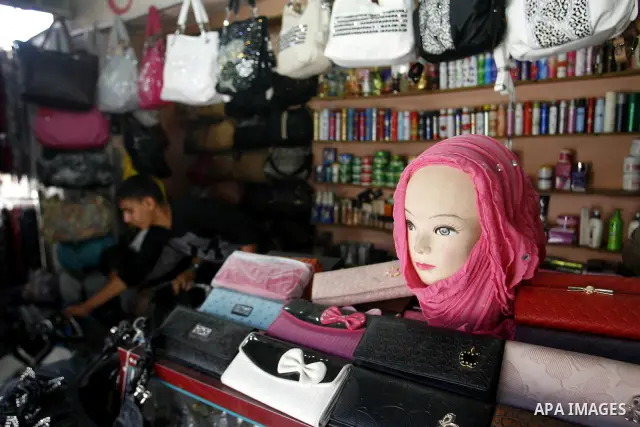 A Palestinian man stands in his shop at market Rafah, southern Gaza city, on June 13, 2012. The European Union's envoy to the Palestinian Authority confirmed its support and allegiance to the people. Photo by Eyad Al Bab...