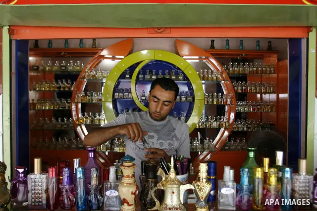 Palestinian vendor prepare perfumes in his shop for perfumes at market Rafah, southern Gaza city, on June 13, 2012. The European Union's envoy to the Palestinian Authority confirmed its support and allegiance to the peop...