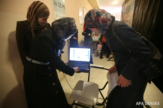 Palestinian students participate in the exhibition of "Creativity of the student" at the Palestine Polytechnic University in the West Bank city of Hebron on 13 June 2012. Photo by Mamoun Wazwaz