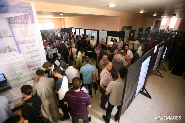 Palestinian students participate in the exhibition of "Creativity of the student" at the Palestine Polytechnic University in the West Bank city of Hebron on 13 June 2012. Photo by Mamoun Wazwaz