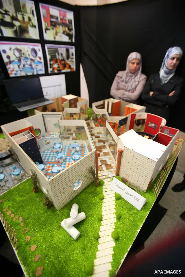 Palestinian students participate in the exhibition of "Creativity of the student" at the Palestine Polytechnic University in the West Bank city of Hebron on 13 June 2012. Photo by Mamoun Wazwaz