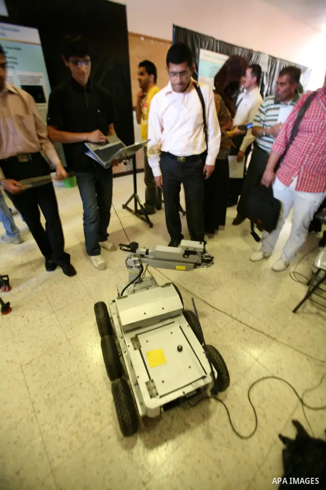 Palestinian students participate in the exhibition of "Creativity of the student" at the Palestine Polytechnic University in the West Bank city of Hebron on 13 June 2012. Photo by Mamoun Wazwaz