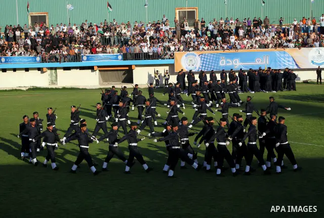 Graduating police officers march during a ceremony at the police academy in Gaza City on June 13, 2012, making them the first batch of officers to graduate after four years of training under the Hamas leadership. Hamas h...