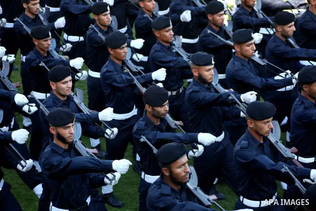 Graduating police officers march during a ceremony at the police academy in Gaza City on June 13, 2012, making them the first batch of officers to graduate after four years of training under the Hamas leadership. Hamas h...