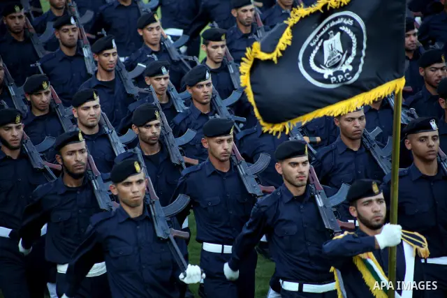 Graduating police officers march during a ceremony at the police academy in Gaza City on June 13, 2012, making them the first batch of officers to graduate after four years of training under the Hamas leadership. Hamas h...