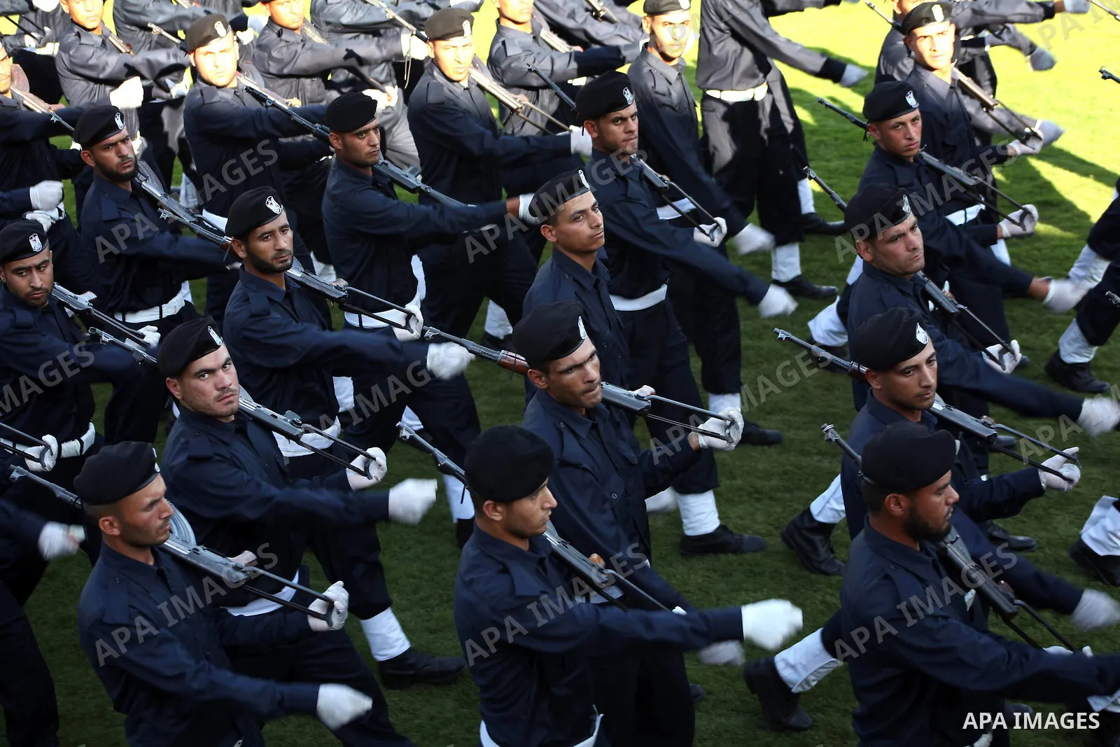 Graduating police officers march during a ceremony at the police academy in Gaza City on June 13, 2012, making them the first batch of officers to graduate after four years of training under the Hamas leadership. Hamas h...