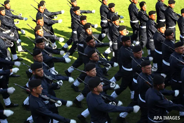 Graduating police officers march during a ceremony at the police academy in Gaza City on June 13, 2012, making them the first batch of officers to graduate after four years of training under the Hamas leadership. Hamas h...