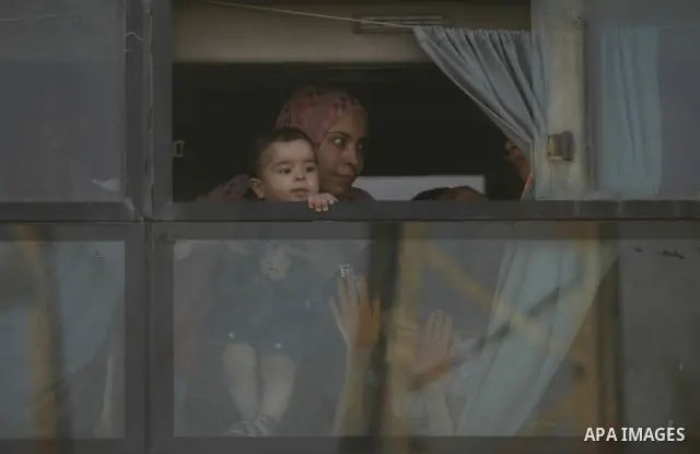 Palestinians load their luggage as they wait to cross into Egypt through the Rafah border crossing in the southern Gaza Strip on June 13, 2013. After the stopping of the Rafah border crossing from the Egyptian side Becau...