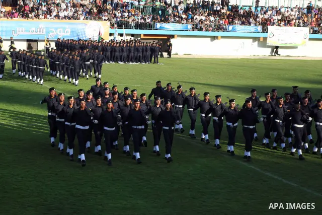 Graduating police officers march during a ceremony at the police academy in Gaza City on June 13, 2012, making them the first batch of officers to graduate after four years of training under the Hamas leadership. Hamas h...