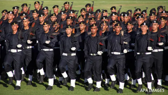 Graduating police officers march during a ceremony at the police academy in Gaza City on June 13, 2012, making them the first batch of officers to graduate after four years of training under the Hamas leadership. Hamas h...