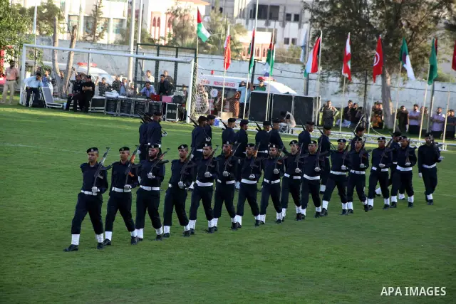 Graduating police officers march during a ceremony at the police academy in Gaza City on June 13, 2012, making them the first batch of officers to graduate after four years of training under the Hamas leadership. Hamas h...