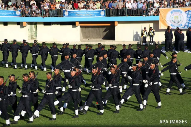 Graduating police officers march during a ceremony at the police academy in Gaza City on June 13, 2012, making them the first batch of officers to graduate after four years of training under the Hamas leadership. Hamas h...