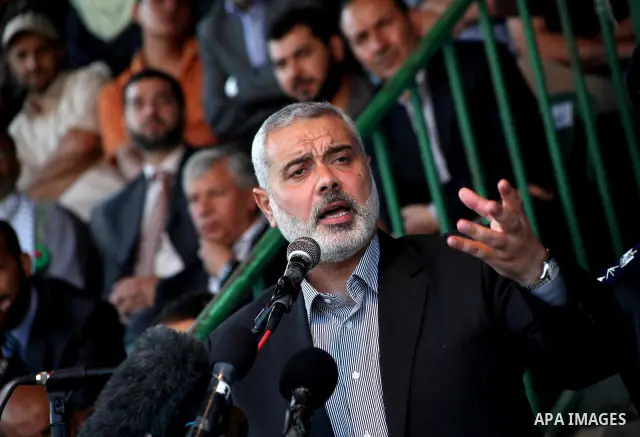 Palestinian Prime Minister in Gaza Ismail Hanyeh, speaks during a graduation police officers ceremony at the police academy in Gaza City on June 13, 2012, making them the first batch of officers to graduate after four ye...