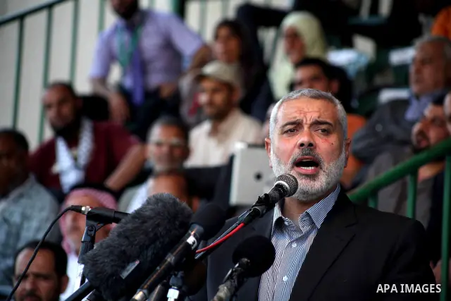 Palestinian Prime Minister in Gaza Ismail Hanyeh, speaks during a graduation police officers ceremony at the police academy in Gaza City on June 13, 2012, making them the first batch of officers to graduate after four ye...