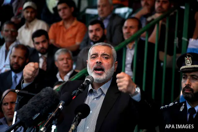 Palestinian Prime Minister in Gaza Ismail Hanyeh, speaks during a graduation police officers ceremony at the police academy in Gaza City on June 13, 2012, making them the first batch of officers to graduate after four ye...