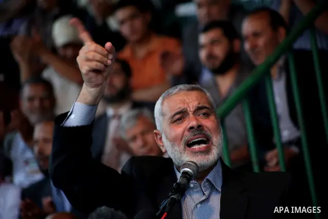 Palestinian Prime Minister in Gaza Ismail Hanyeh, speaks during a graduation police officers ceremony at the police academy in Gaza City on June 13, 2012, making them the first batch of officers to graduate after four ye...