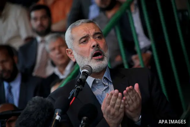 Palestinian Prime Minister in Gaza Ismail Hanyeh, speaks during a graduation police officers ceremony at the police academy in Gaza City on June 13, 2012, making them the first batch of officers to graduate after four ye...