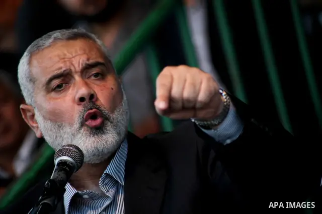 Palestinian Prime Minister in Gaza Ismail Hanyeh, speaks during a graduation police officers ceremony at the police academy in Gaza City on June 13, 2012, making them the first batch of officers to graduate after four ye...