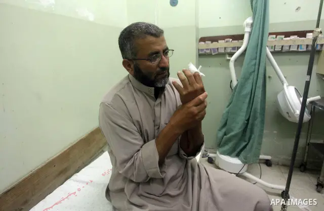 A Palestinian wounded man arrives to Naser hospital following an Israeli strike on June 14, 2012 in Khuza'a town , in the east of Khan Younis city in the south of gaza strip. Photo by Ashraf Amra
